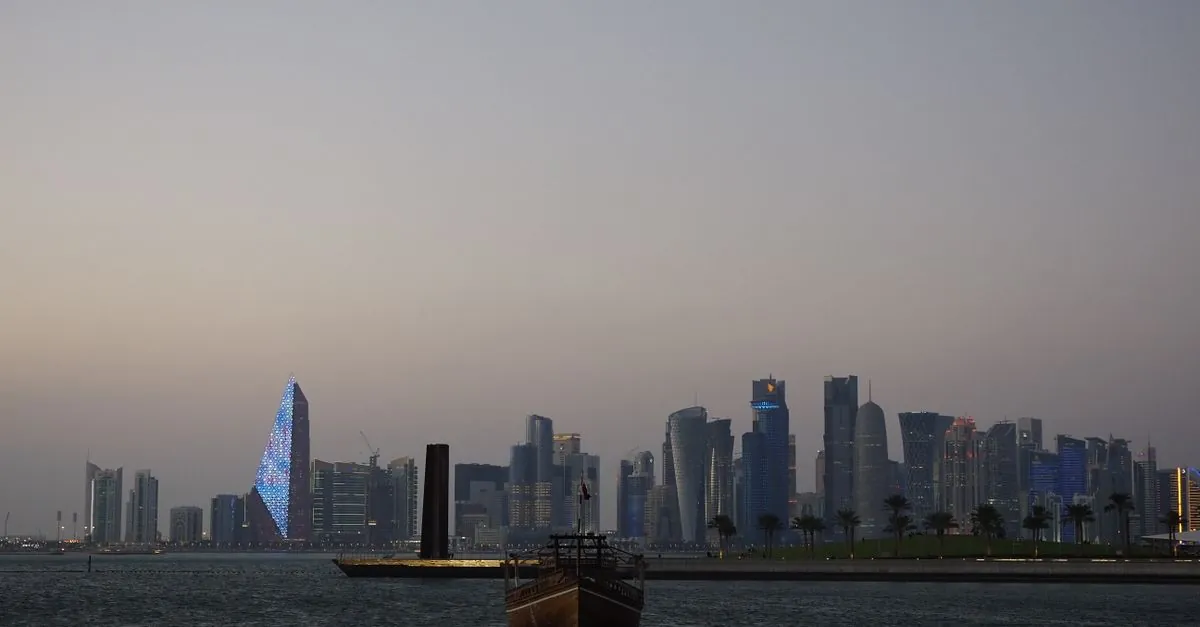 The Doha skyline at dusk, with towers along the waterfront.